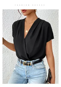 Detail of elegant black deep V-neck surplice bodysuit with stylish draped texture