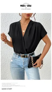 Detail of elegant black wrap bodysuit featuring deep V-neckline and batwing sleeves