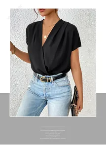 Detail of elegant black deep V-neck chiffon bodysuit with short batwing sleeves and gold belt