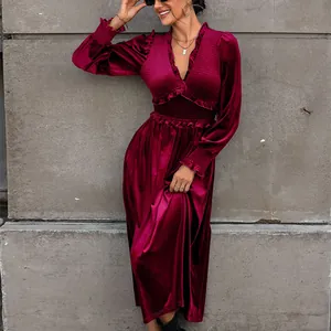 Elegant burgundy velvet maxi dress featuring smocked waist and ruffled V-neck details