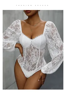 Close-up of white floral lace pattern and puff sleeves on the slim fit bodysuit