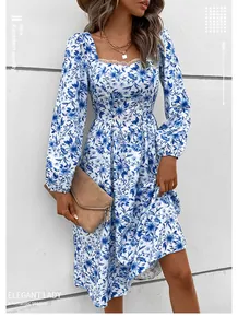 Detail of square neckline with lace trim on white and blue floral long sleeve dress