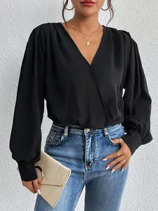 Elegant black deep V-neck long sleeve wrap jumpsuit with sophisticated draped pleats