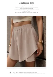 Detailed close-up of high-waist textured shorts with elastic waistband and layered design