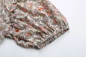 Close-up of elastic puff sleeve cuff with vintage floral print on breathable fabric