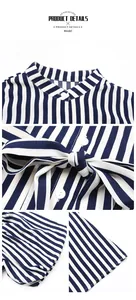 Détails de la robe à rayures bleues avec col montant boutons et ceinture à nouer