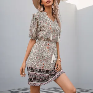 Bohemian floral summer dress with V-neck, tassel ties and an elastic waist detail