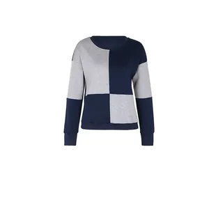 Close-up of crewneck sweatshirt with blue and gray block stitching and ribbed texture