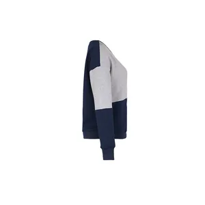 Detail of navy diamond textured fabric and grey patchwork on long sleeve sweatshirt