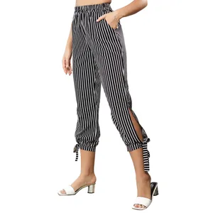 Women's high waist black and white striped cropped pants with side slit and bow detail