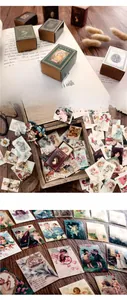 Vista macro di carte di carta vintage per collage con motivi retrò artistici e scatola