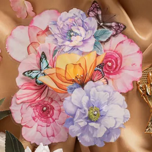 Floral and butterfly decorative 3D stickers with pearls on a gold satin backdrop