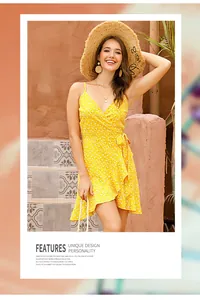 Detailed view of the yellow polka dot wrap dress with delicate spaghetti straps and ruffles