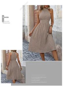 Detailed back view of a halter neck dress with geometric print and teardrop cutout