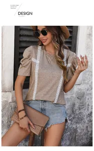 Detail of khaki lace-patchwork T-shirt featuring elegant puff sleeves and a textured finish