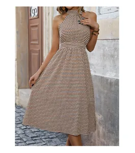 Close-up of halter neckline and geometric zigzag pattern on high waist midi dress
