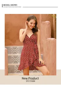 Detail of red floral wrap dress with V-neckline, spaghetti straps and ruffled hem design