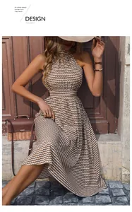 Detailed texture of brown and white checkered halter dress with elegant waist design
