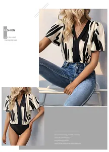 Detail of V-neck bodysuit with black and white abstract print and ruffle sleeves