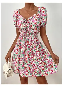 Detail of floral puff sleeve dress with sweetheart neckline and smocked high waist