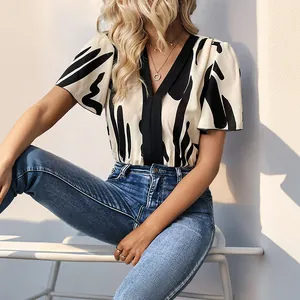 Elegant V-neck bodysuit with abstract ink print and ruffle sleeves for casual wear