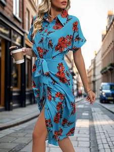 Sky blue shirt dress with red floral print, short sleeves and waist tie for a chic summer look