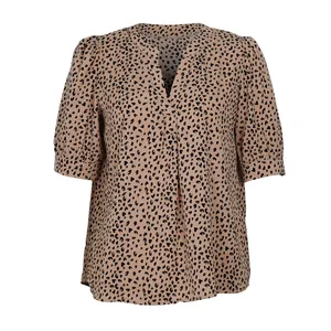 Detail of V-neck leopard print shirt with puff sleeves and ruffled chest decoration