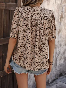 Back view of a casual leopard print short sleeve shirt with v-neck and pleated back detail
