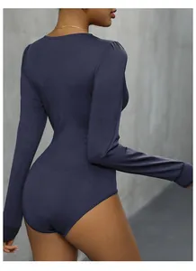 Rear view of sleek long-sleeve bodysuit in navy blue with slim fit and snap closure