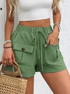 Women's green casual cargo shorts with elastic drawstring waist and large buttoned pockets