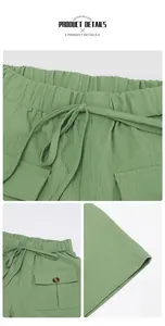 Detail of green summer shorts showing elastic drawstring waist and pleated texture fabric