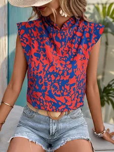 Detail of bohemian sleeveless top featuring vibrant red and blue abstract floral print