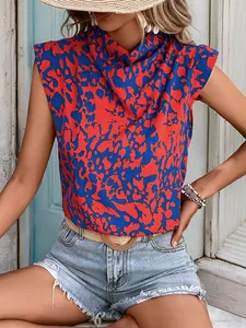 Detail of bohemian sleeveless cowl neck blouse featuring red and blue marble print