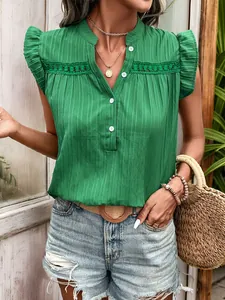 Detail of green sleeveless shirt with ruffled sleeves, V-neck, and lace hollow design