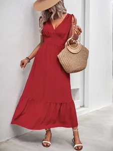 Detail of red deep V-neck backless maxi dress with pleated texture and ruffled hem