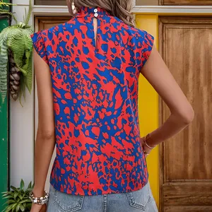 Women's sleeveless bohemian halter top with red and blue abstract print and back cutout