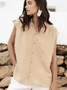 Minimalist beige cotton linen sleeveless button-up shirt for women in a relaxed style