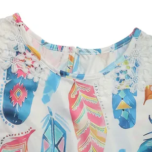 Detailed view of white lace trim neckline with colorful feather print and back zipper