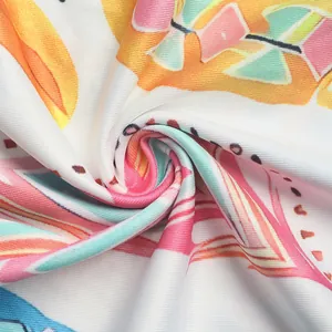 Detailed macro view of colorful lace fabric with vibrant geometric patterns and mesh texture