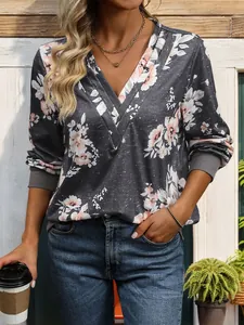 Detail of V-neck floral sweatshirt with ribbed cuffs and grey melange texture fabric