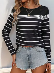 Detail of striped long sleeve tee paired with frayed denim shorts and a brown belt