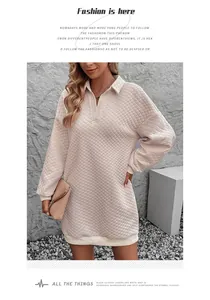 Detail of light pink quilted long sleeve dress with polo collar and ribbed cuffs
