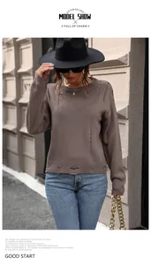 Outdoor model wearing a brown crewneck knit sweater with distressed ripped details
