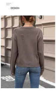 Detailed back view of brown oversized knit sweater featuring distressed hollow out textures