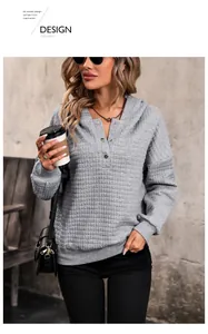 Detail view of grey waffle knit texture and buttoned henley neckline on a casual hoodie