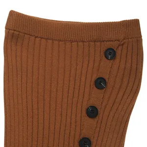 Close-up of caramel knit skirt waist featuring vertical ribbing and four black side buttons
