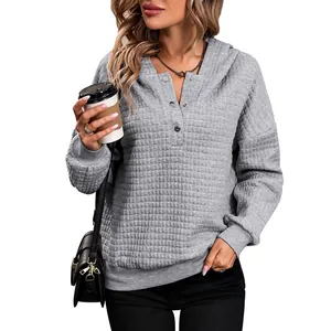 Women's dark grey quilted waffle knit hoodie with long sleeves and buttoned collar
