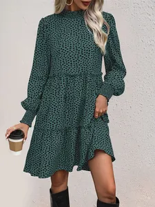 Detail of green leopard print dress with high ruffled neck and elastic cuffs
