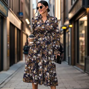 Detail of floral V-neck midi dress with ruffled collar and elastic cuffs in street setting