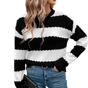 Women's crewneck knit sweater featuring black and white horizontal stripes and drop shoulders